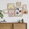 image:imageFrametory Floating Picture Frames Set  Bronze Metal Photo Frames  Real Glass  Display One 11x14 Two 8x10 and Four 5x7 Inch Photos for Home DecorationBronze