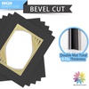 image:imageMat Board Center 5 Pack 11x14 Double Mat for 85x11 Photos Off WhiteGold  Off White Over Gold Double Mat Board Acid Free 8Ply Thickness White Core Bevel Cut for Photos amp Art FramingBlack Over Gold
