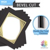 image:imageMat Board Center 5 Pack 11x14 Double Mat for 85x11 Photos Off WhiteGold  Off White Over Gold Double Mat Board Acid Free 8Ply Thickness White Core Bevel Cut for Photos amp Art FramingBlack Over Gold