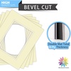 image:imageMat Board Center 5 Pack 11x14 Double Mat for 85x11 Photos Off WhiteGold  Off White Over Gold Double Mat Board Acid Free 8Ply Thickness White Core Bevel Cut for Photos amp Art FramingIvory Over Ivory
